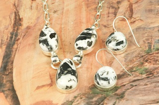 Genuine White Buffalo Turquoise set in Sterling Silver. Beautiful Necklace and Earrings Set. This Beautiful Stone is formed from the minerals Calcite and Iron. It is mined near Tonopah Nevada.   Created by Navajo Artist Tony Garcia. Signed by the artist.